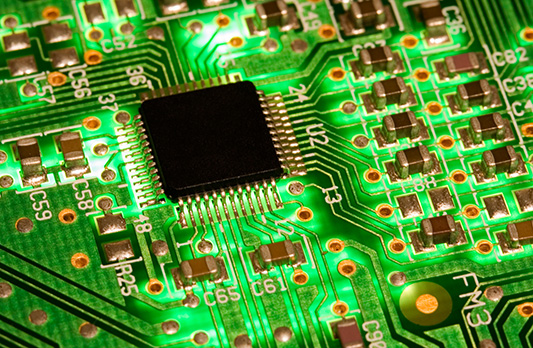 components and traces on a backlit two-layer circuit board