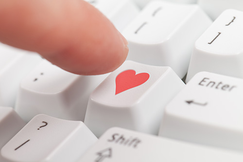 A key on a keyboard with a heart on it.