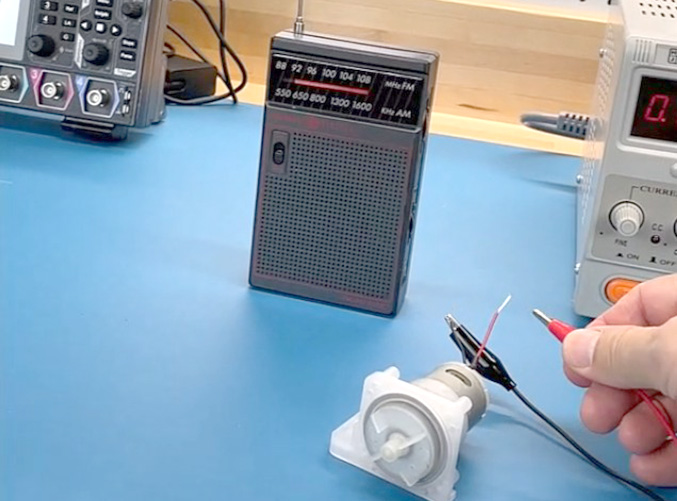 DC brushed motor and an AM radio