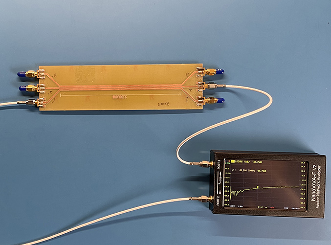 VNA connected to test board with three parallel microstrip traces